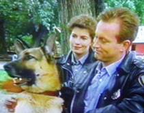 Hank Katts (Jesse Collins) and Rene Daumier (Denise Virieux) together with Rinty/Rudy in Katts and Dog / Rin Tin Tin K-9 Cop.
